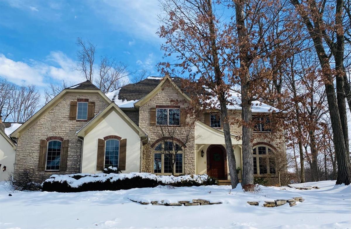 DISTINCTIVE, UNIQUE CUSTOM HOME NESTLED ON PRIVATE WOODED LAKE LOT